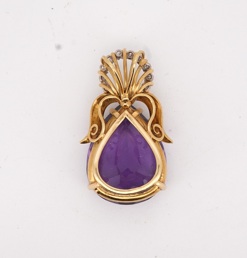 An Amethyst and diamond pendant, claw-set with a pear-shaped amethyst, topped with a foliate surmount in textured gold, accented with and arc of brilliant-cut diamonds totalling approximately 0.30 carats, length 3.5cm, s